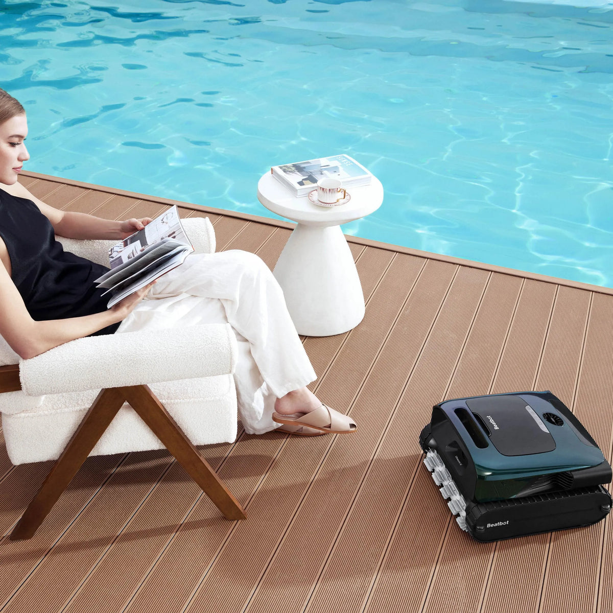Cordless pool robot parked at the edge after a cleaning cycle