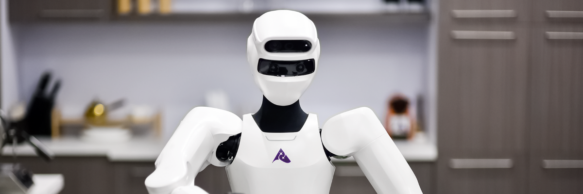 Astribot S1 humanoid robot with two arms raised over a countertop
