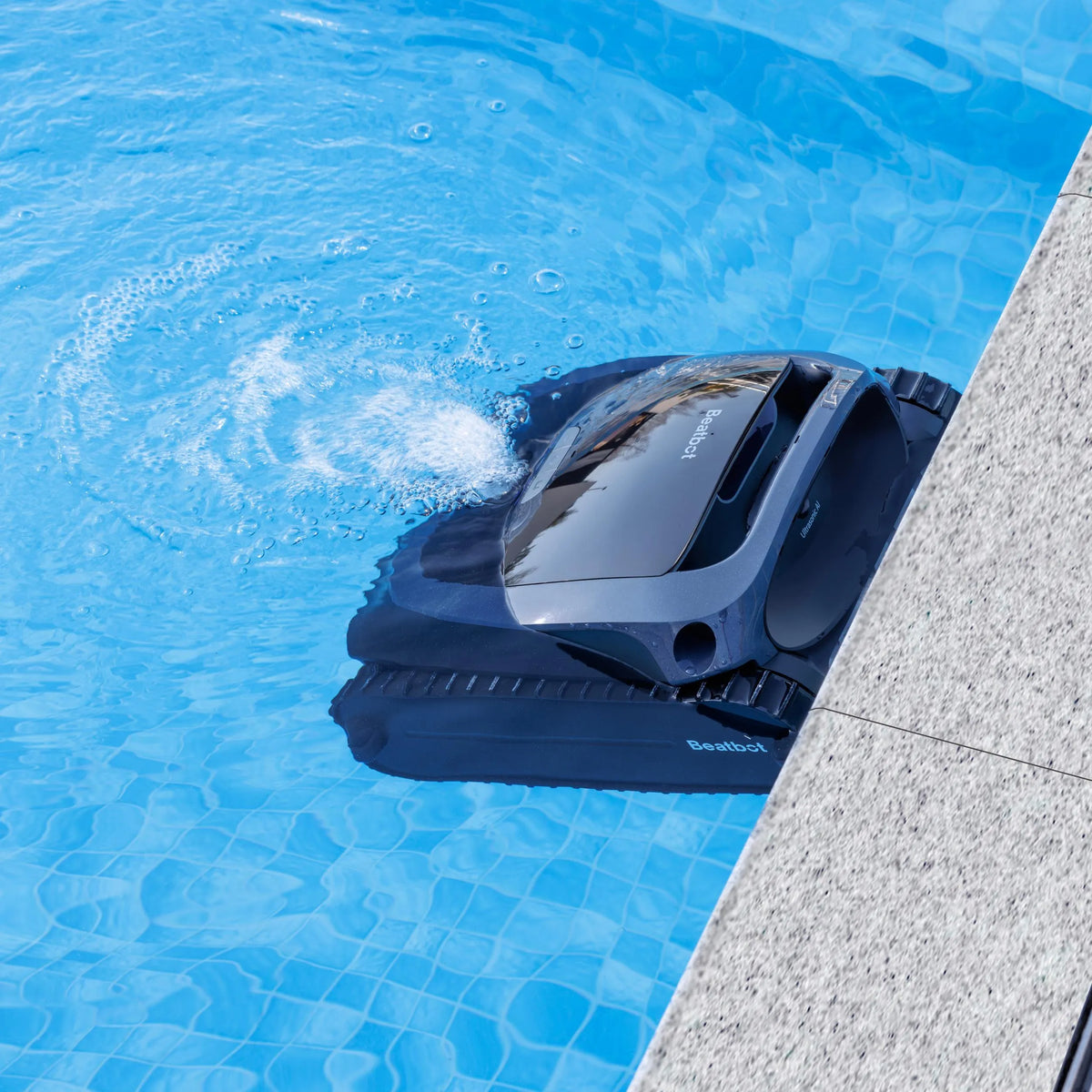 AquaSense cleaner parked at the pool wall after a cycle