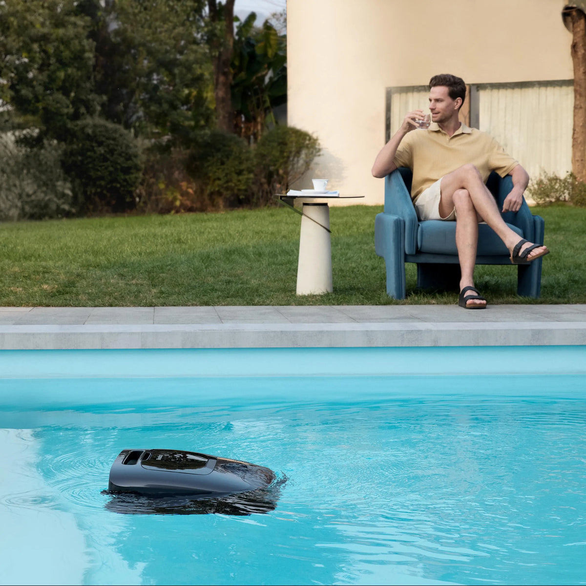 A floor robot and a surface skimmer working the same pool at the same time