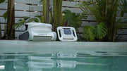 Chasing Hydro 4 battery pool cleaner and battery buoy on a pool deck