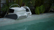 Chasing Hydro 4 battery pool cleaner on a pool deck