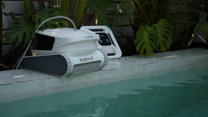 Chasing Hydro 4 battery pool cleaner on a pool deck