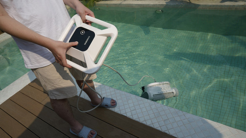 Chasing Hydro 4 battery pool cleaner being lowered into a pool