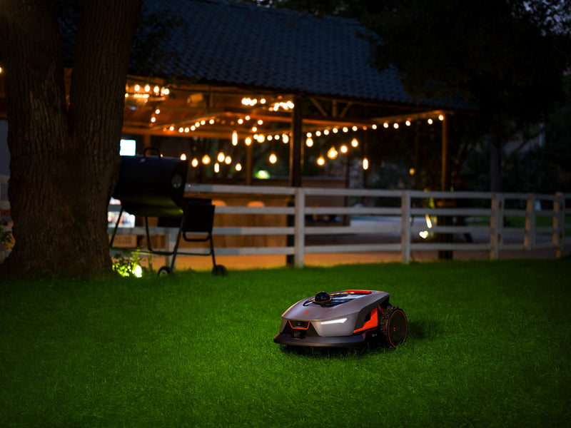 Sunseeker Elite X4 robotic lawn mower, mowing at night