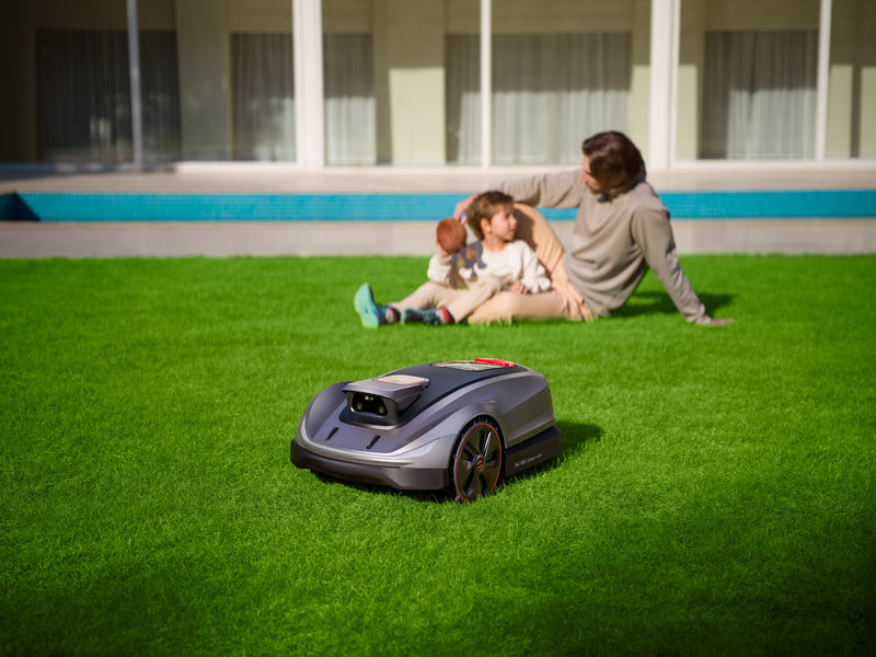 Sunseeker Elite X5 Gen 2 robotic lawn mower, on a residential lawn