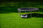 Sunseeker Elite X7 Gen 2 robotic lawn mower, mowing a residential lawn