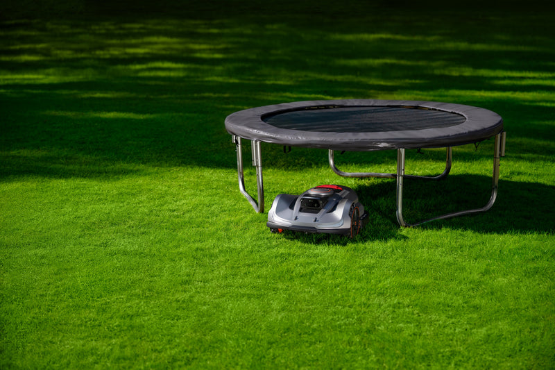 Sunseeker Elite X7 Gen 2 robotic lawn mower, mowing a residential lawn