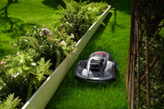 Sunseeker Elite X7 Gen 2 robotic lawn mower, mowing in daylight
