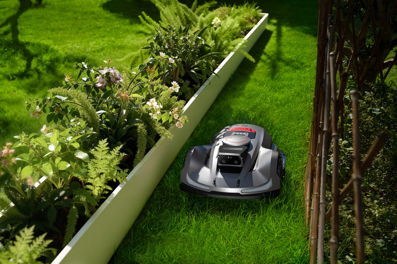 Sunseeker Elite X7 Plus Gen 2 robotic lawn mower, mowing in daylight