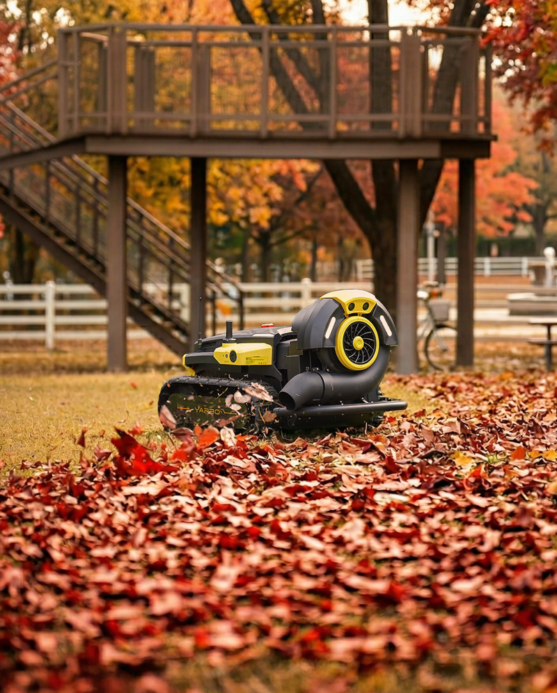 Yarbo Blower clearing fallen leaves from a backyard deck area