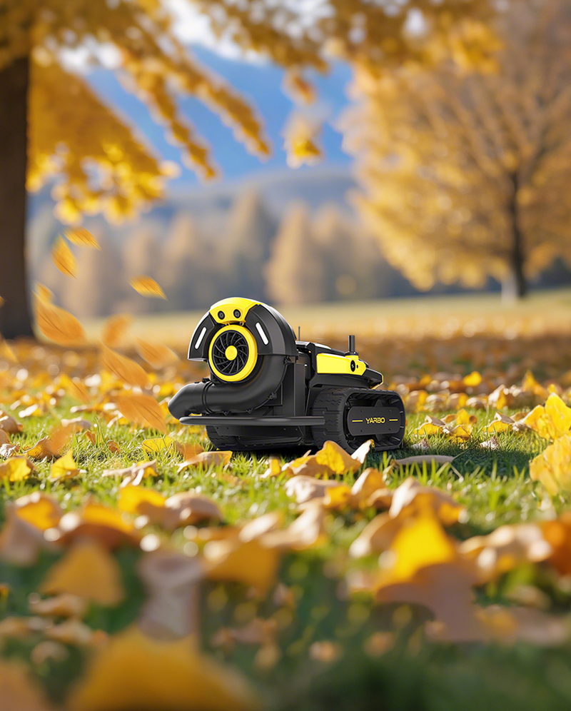 Yarbo Blower moving through autumn leaves on a lawn