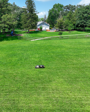 Yarbo mowing a large lawn, aerial view