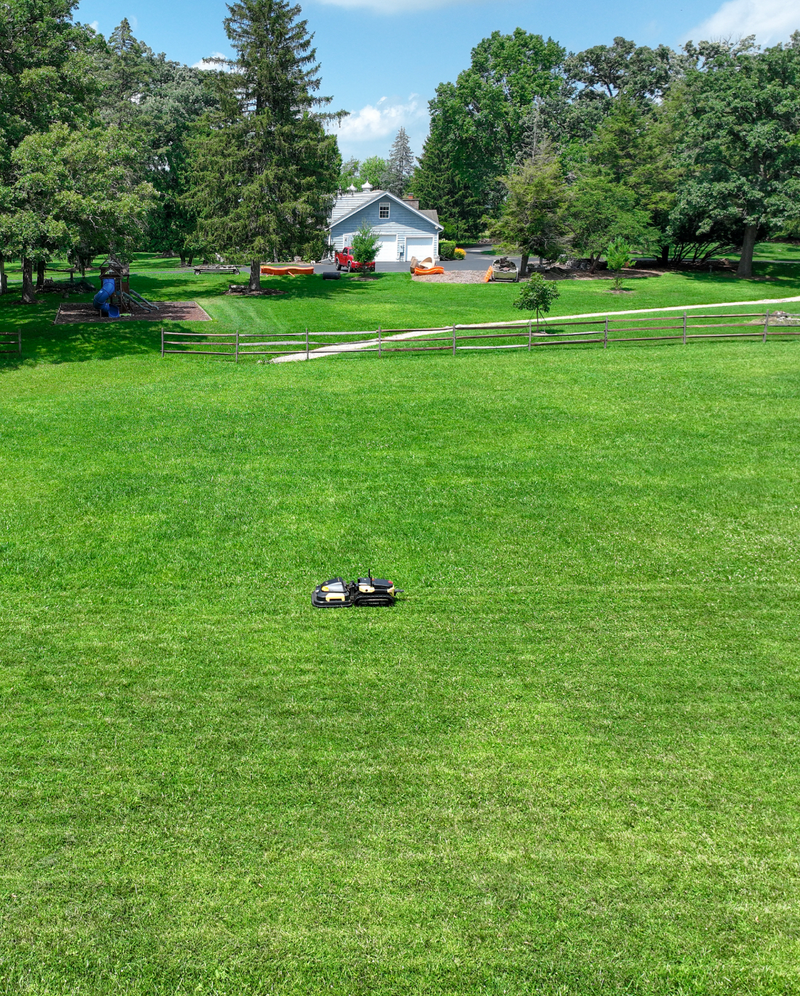 Yarbo mowing a large lawn, aerial view